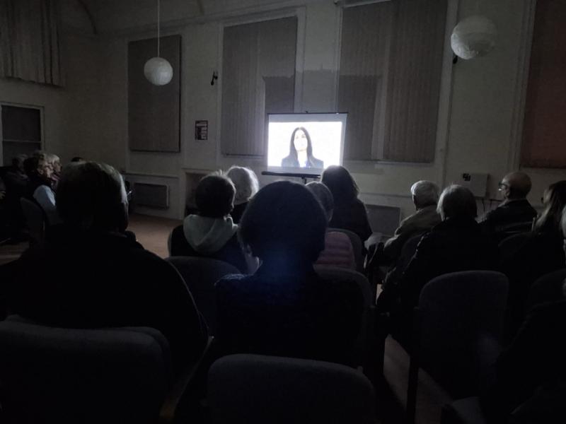 Audience watching The Hardest Bridge at the Quaker Meeting House in Henley-on-Thames