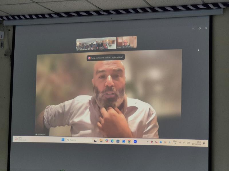 Director Imad Karam on screen via Zoom, responding to questions from the audience in Kenya