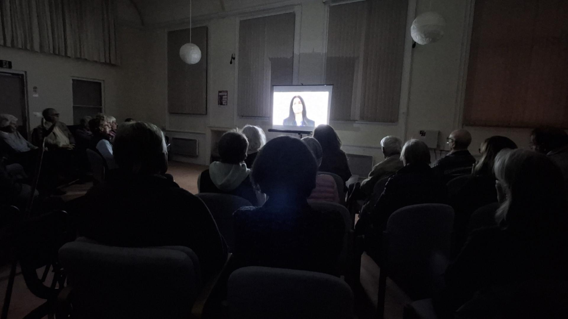 Audience watching The Hardest Bridge at the Quaker Meeting House in Henley-on-Thames