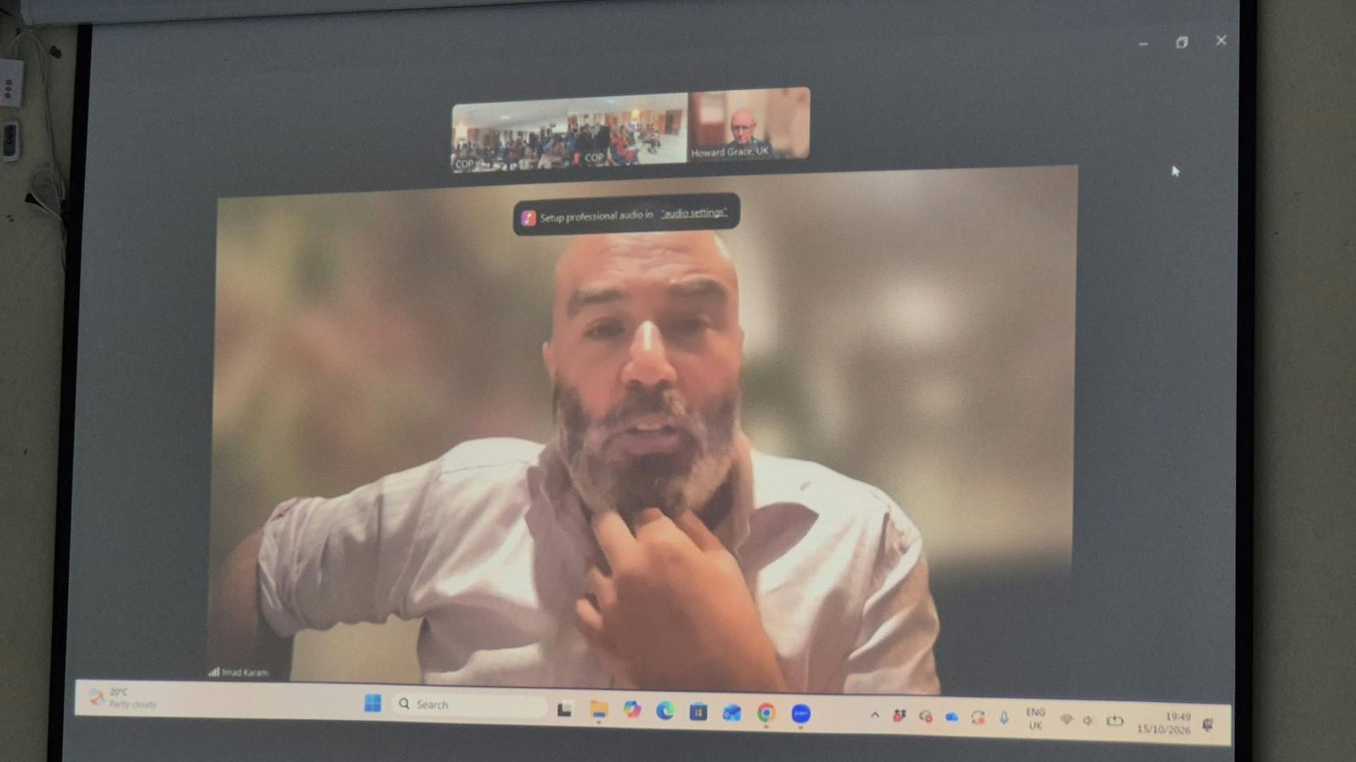 Director Imad Karam on screen via Zoom, responding to questions from the audience in Kenya